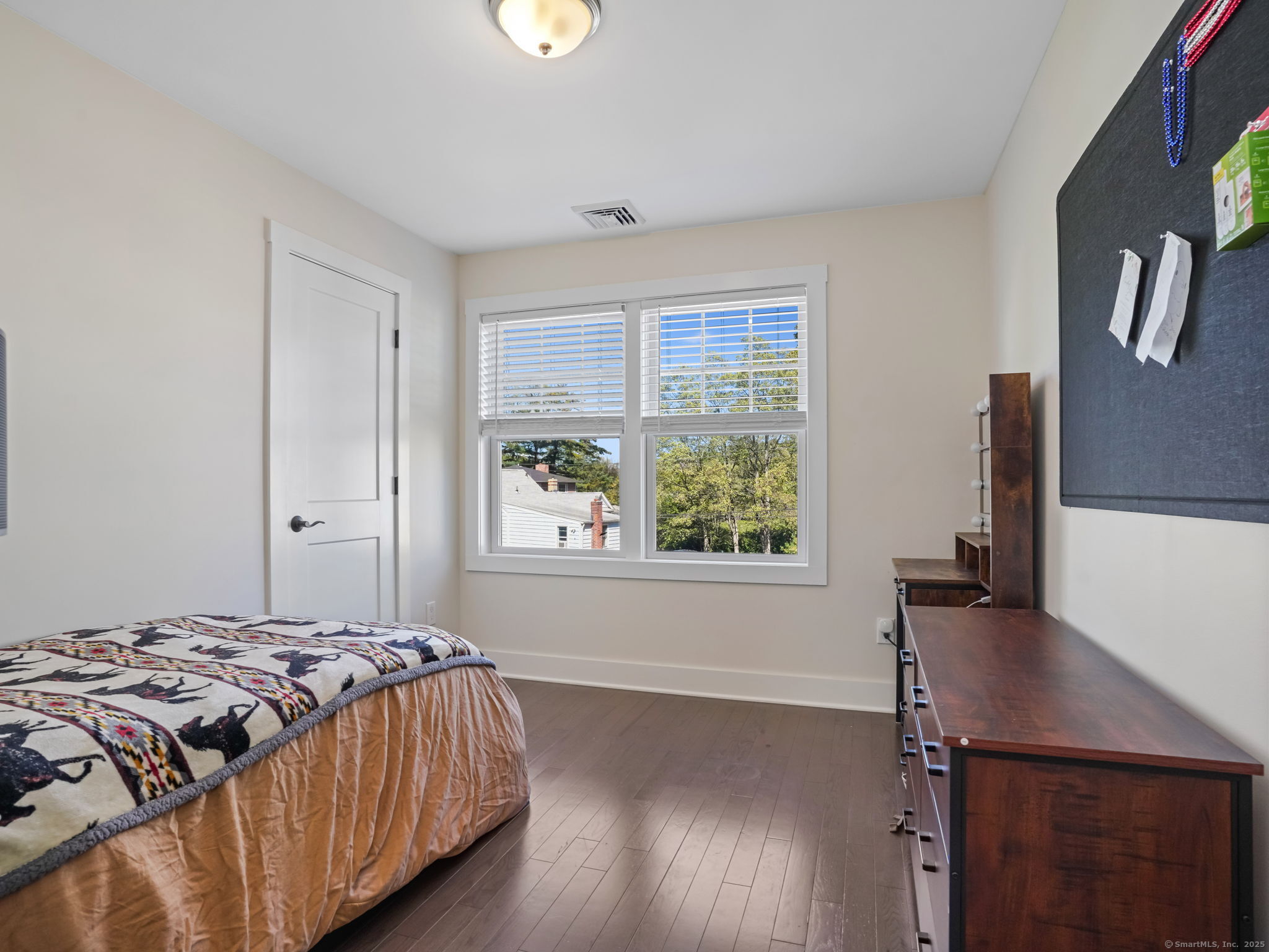 118 Berwick Avenue, Unit 118 Fairfield, CT 06825 - Photo 19 of 29 a bedroom with a bed and a window