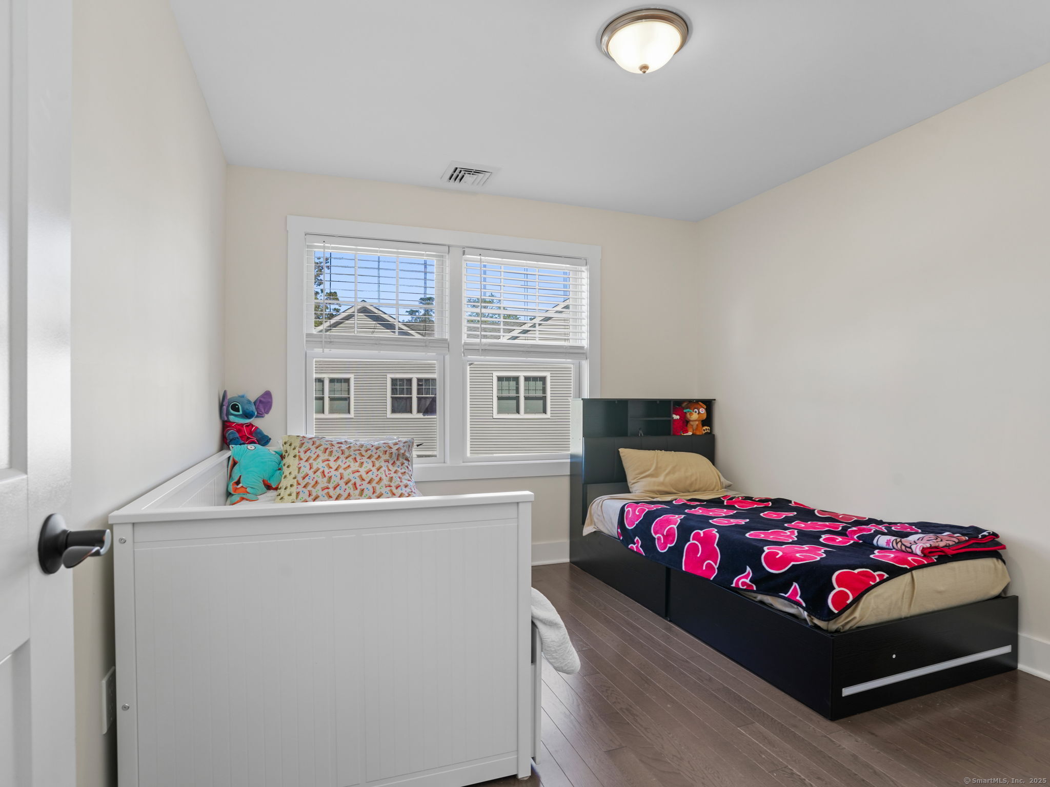 118 Berwick Avenue, Unit 118 Fairfield, CT 06825 - Photo 21 of 29 a bedroom with a bed and a dresser