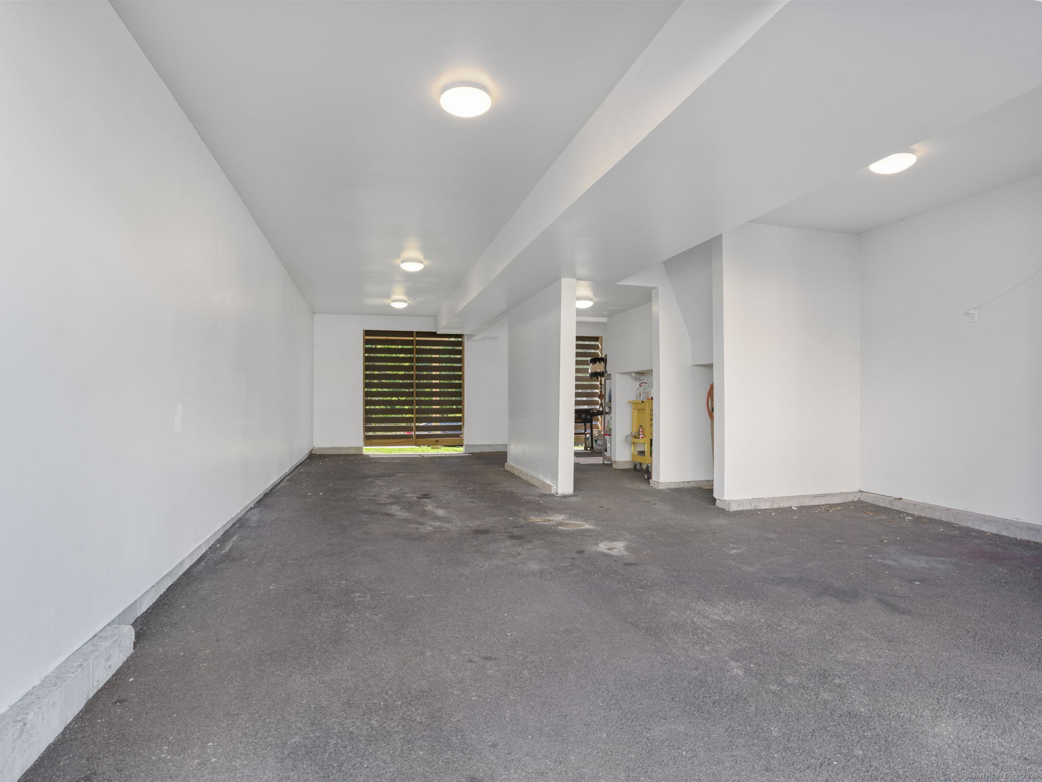118 Berwick Avenue, Unit 118 Fairfield, CT 06825 - Photo 26 of 29 a view of an empty room with a window
