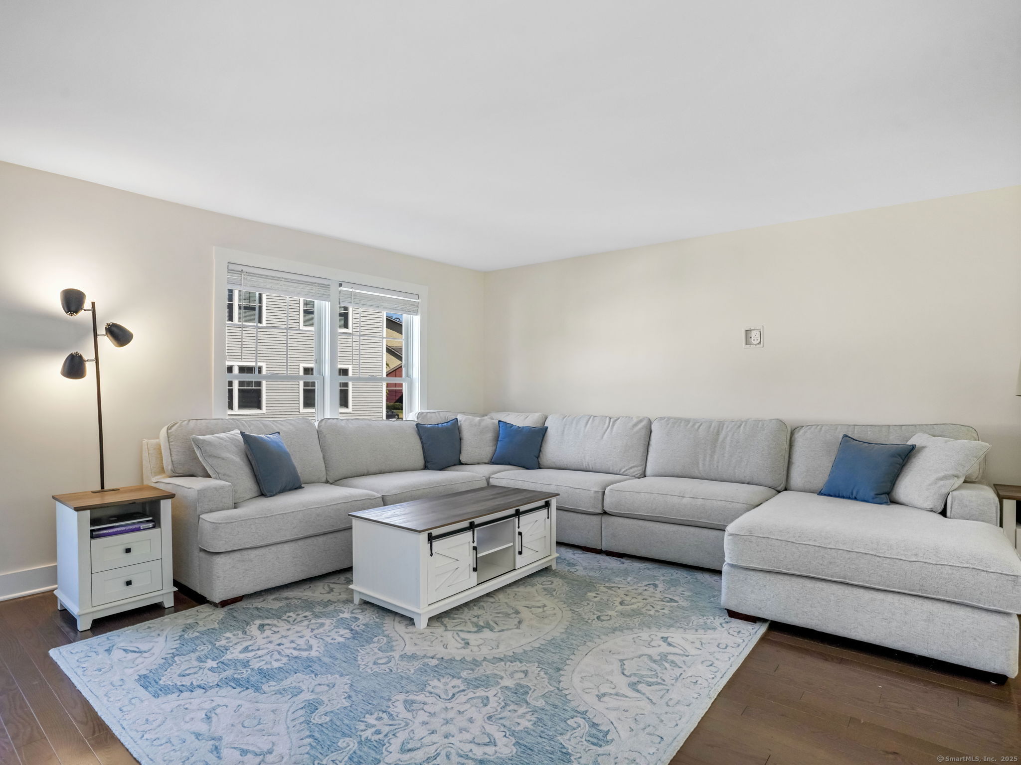 118 Berwick Avenue, Unit 118 Fairfield, CT 06825 - Photo 3 of 29 a living room with furniture and a couch