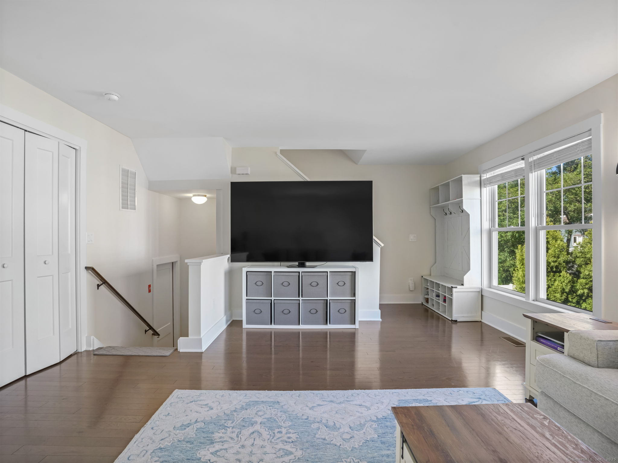 118 Berwick Avenue, Unit 118 Fairfield, CT 06825 - Photo 6 of 29 a living room with furniture and a flat screen tv