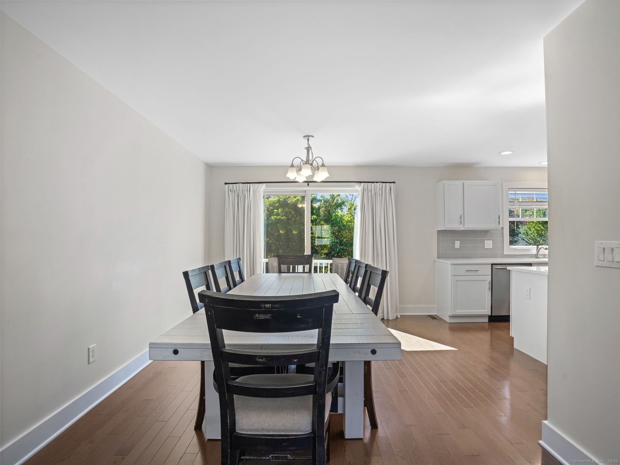 118 Berwick Avenue, Unit 118 Fairfield, CT 06825 - Photo 8 of 29 a dining room with furniture and window