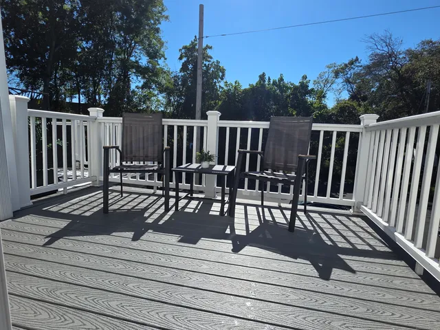a view of a chairs and table on the deck
