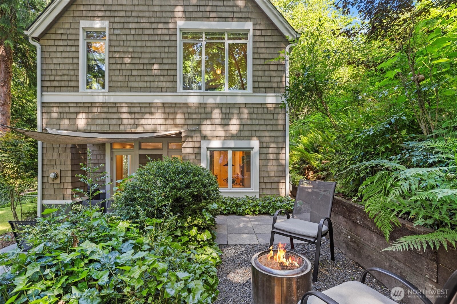 4309 Olympic Boulevard Everett, WA 98203 - Photo 34 of 40 a view of a patio with table and chairs potted plants and barbeque oven