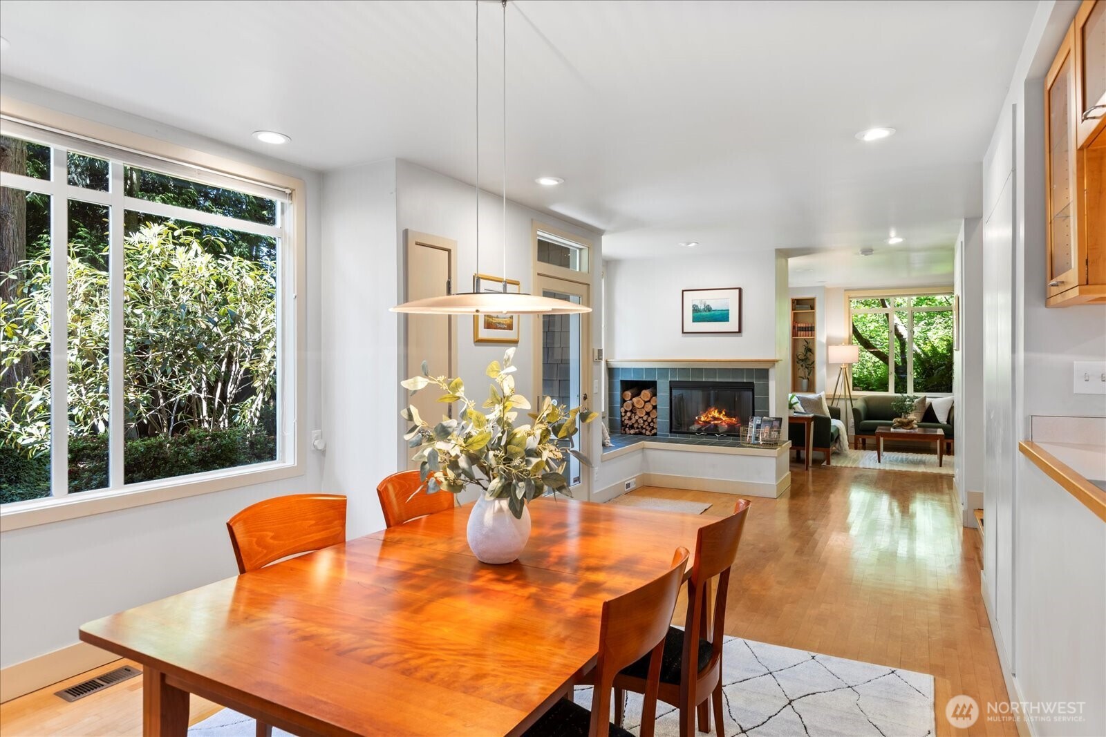 4309 Olympic Boulevard Everett, WA 98203 - Photo 10 of 40 a dining room with furniture a fireplace and wooden floor