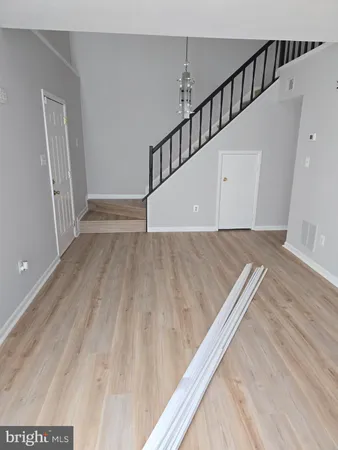 a view of wooden floor with staircase