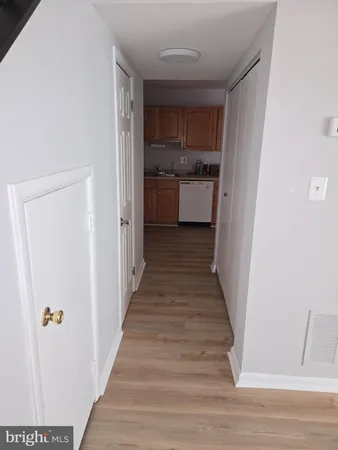 a view of a kitchen from the hallway