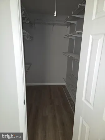 a white toilet sitting next to a bath tub and a shower