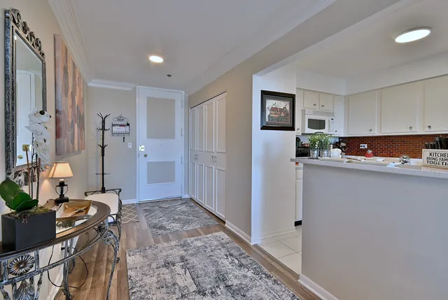 a kitchen with a refrigerator and a stove top oven
