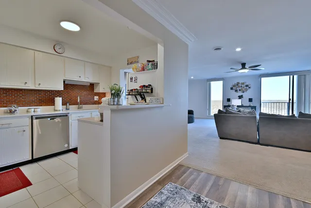 a kitchen with cabinets and window