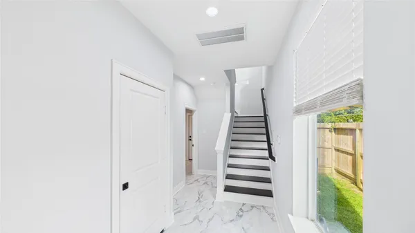 a view of entryway with stairs