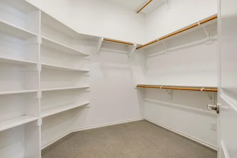 a view of an empty walk in closet