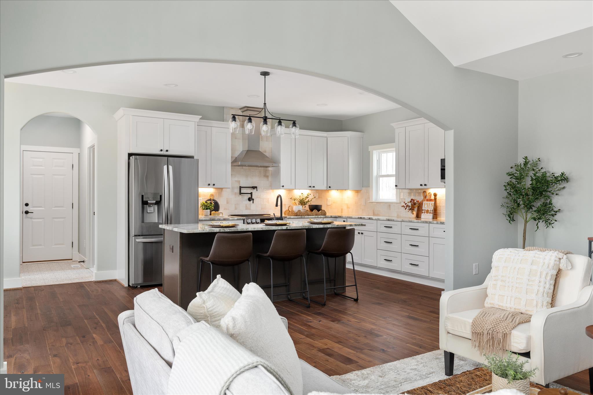 14305 Inlet Road Culpeper, VA 22701 - Photo 11 of 73 Arch opening between kitchen and great room