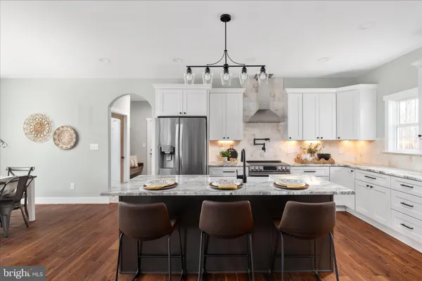 a kitchen with sink and cabinets