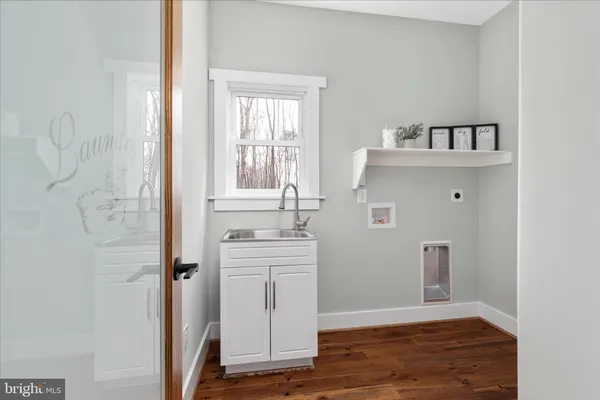 a bathroom with a double vanity sink and a mirror