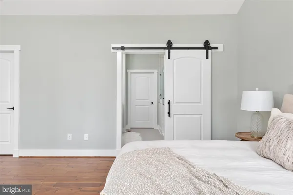 a view of staircase and utility room with empty racks