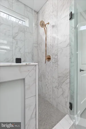 a bath tub sitting next to a bathroom sink