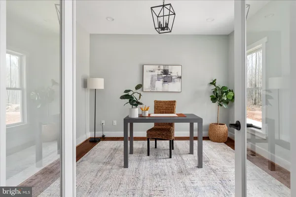 a living room with furniture a window and a fireplace