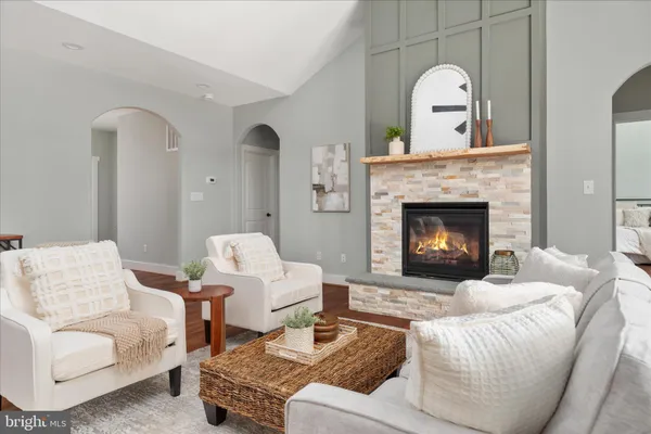 a kitchen with kitchen island granite countertop a sink cabinets and stainless steel appliances