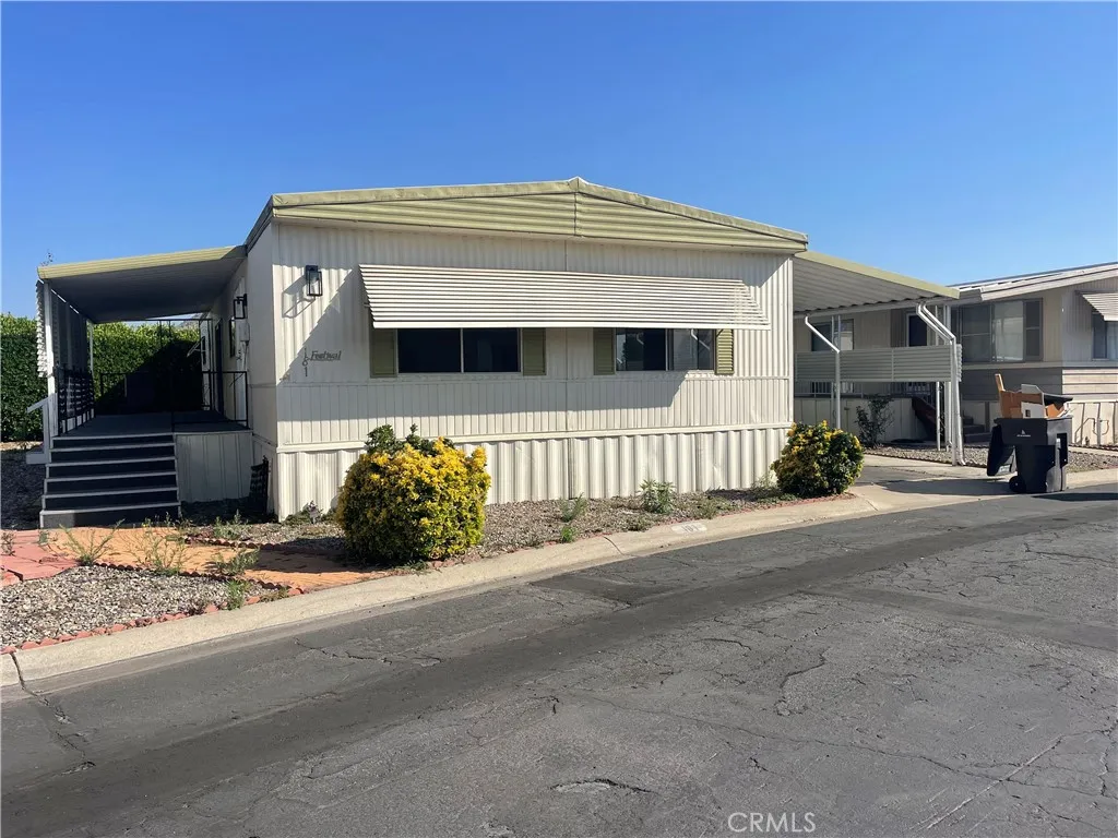 3700 Buchanan Street, Unit 181 Riverside, CA 92503 - Photo 1 of 1 a front view of a house with a yard