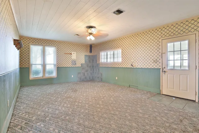 a view of an empty room with a window