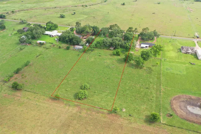 a view of a big yard with green space