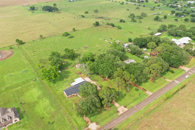 a bathroom with a yard view and lake view