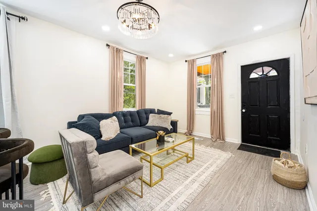 a view of a livingroom with furniture and window