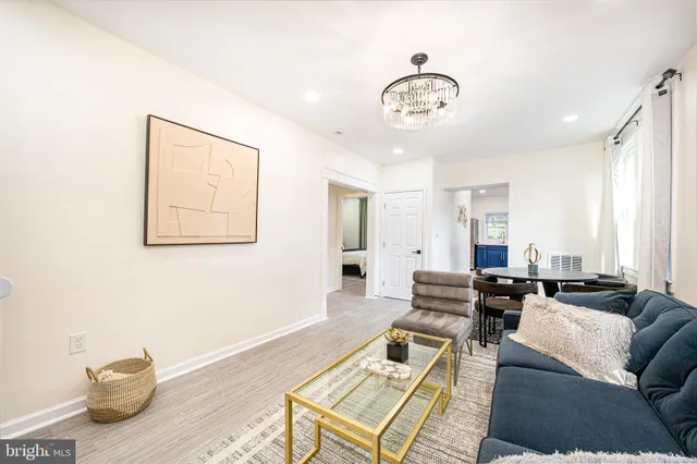 a kitchen with stainless steel appliances granite countertop a stove microwave and sink