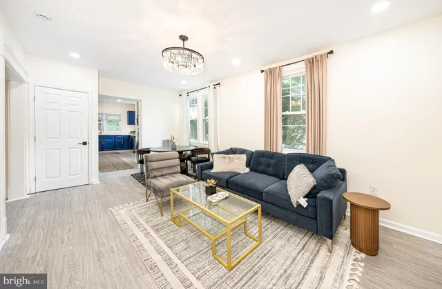 a kitchen with a sink refrigerator and window