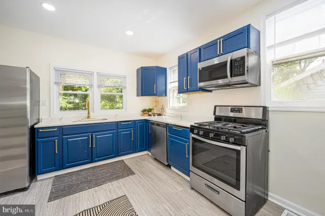 a kitchen with a sink and a window