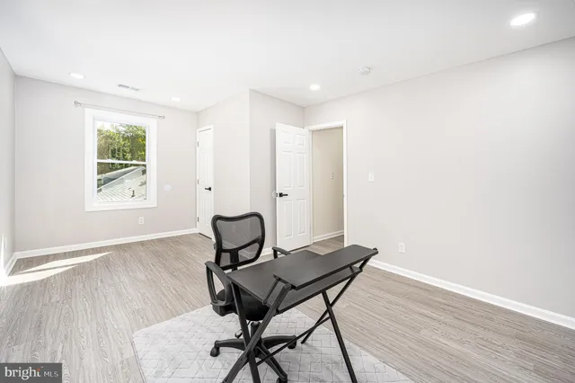 a workspace with furniture and wooden floor