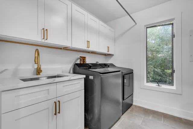 a kitchen with a refrigerator and cabinets
