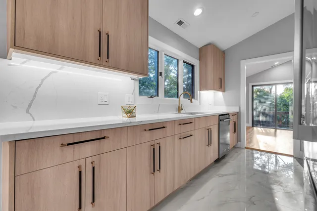 a bathroom with a sink and a window