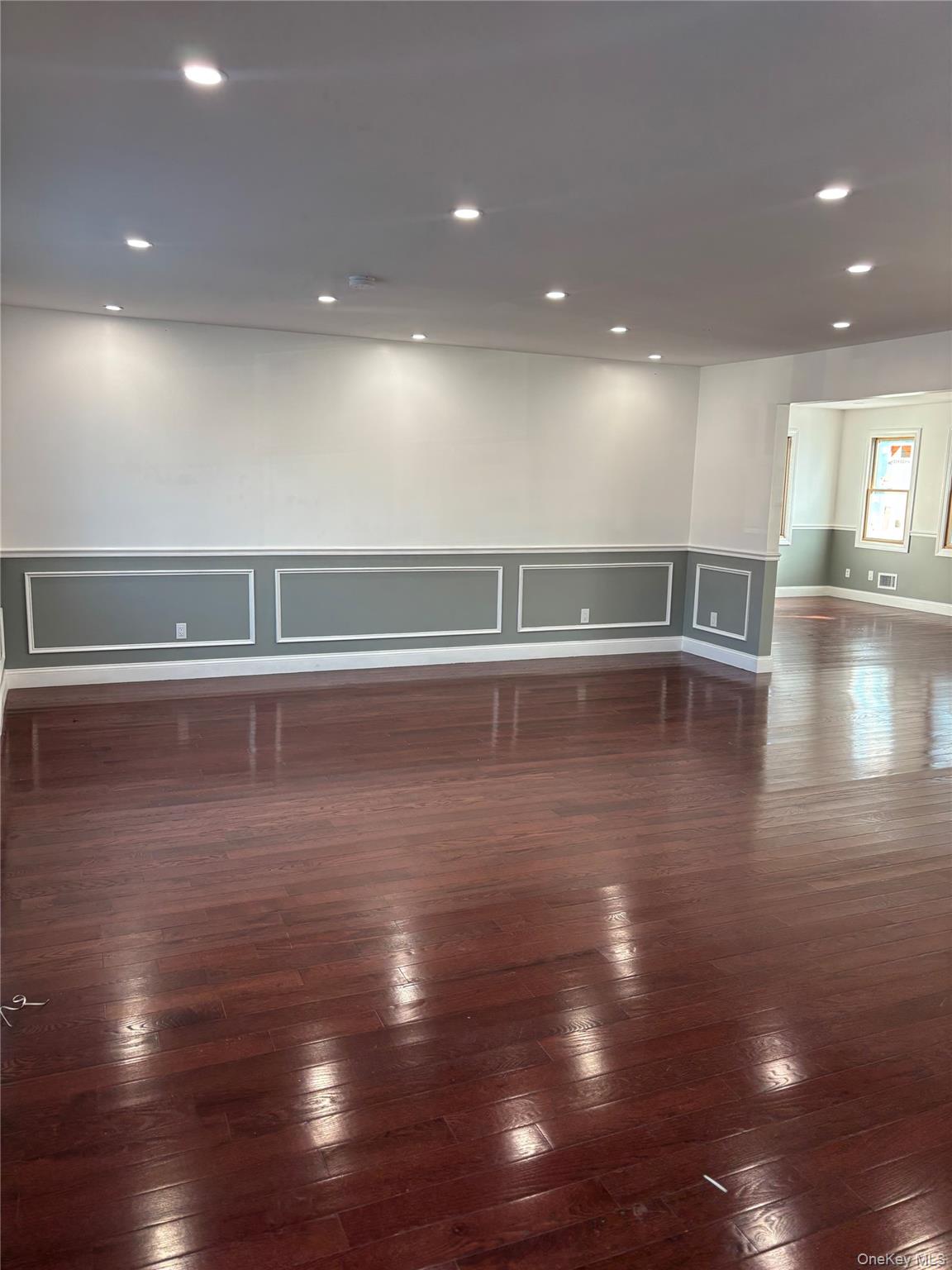 44 School Street Malverne, NY 11565 - Photo 4 of 19 a view of empty room with wooden floor
