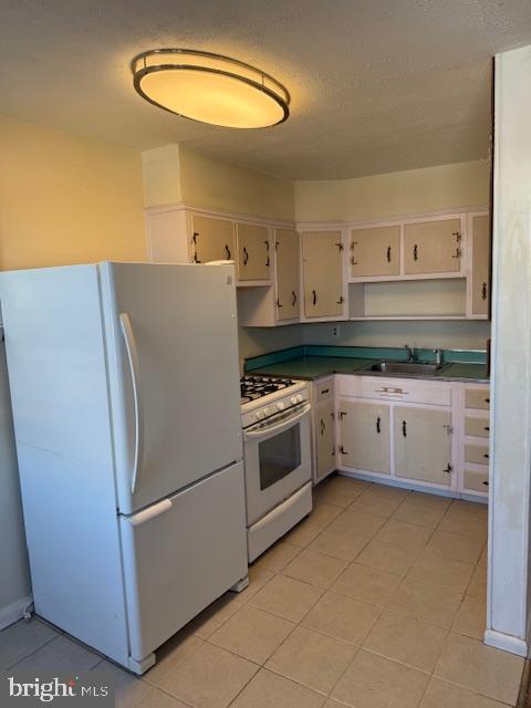 237 Lauriston Street Philadelphia, PA 19128 - Photo 8 of 22 a white refrigerator freezer sitting inside of a kitchen