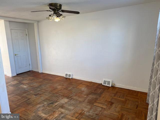 237 Lauriston Street Philadelphia, PA 19128 - Photo 9 of 22 an empty room with a ceiling fan and a window