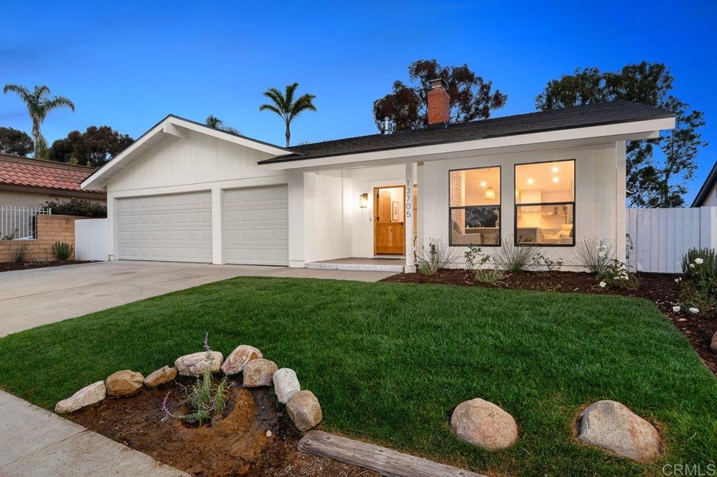 13705 Mango Drive Del Mar, CA 92014 - Photo 1 of 35 a front view of a house with a yard