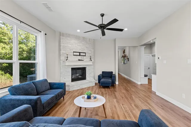 a hallway with a table and a chair