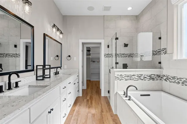a bathroom with a bathtub and a window