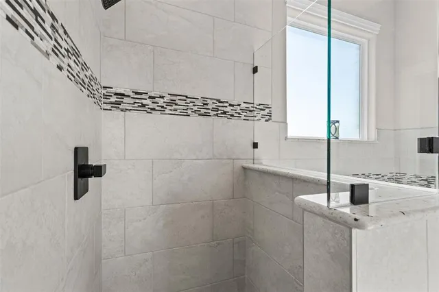 a view of a closet with wooden floor