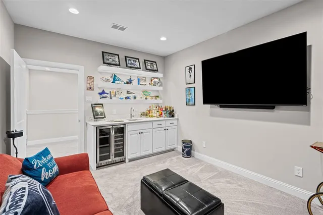 a view of cabinets and wooden floor