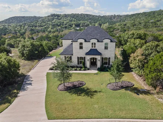 a aerial view of a house with a big yard