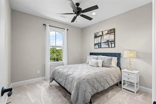 a view of a porch with furniture and backyard
