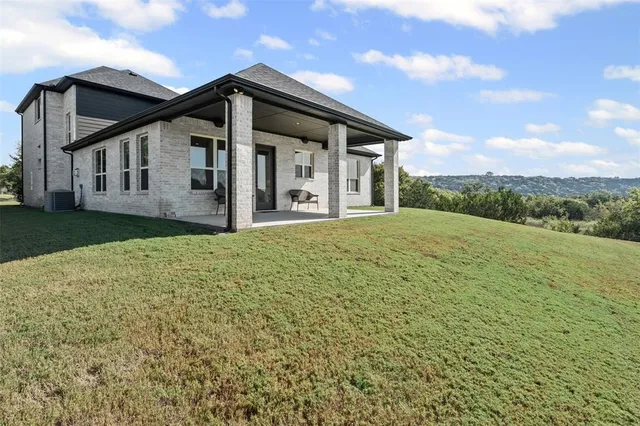 an aerial view of residential house and green space