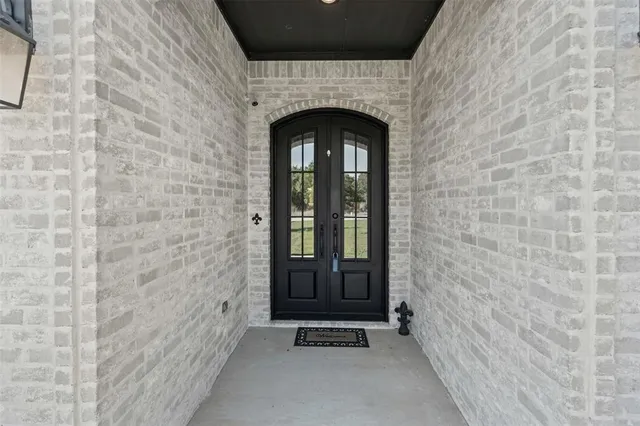a kitchen with stainless steel appliances granite countertop a sink a stove and refrigerator