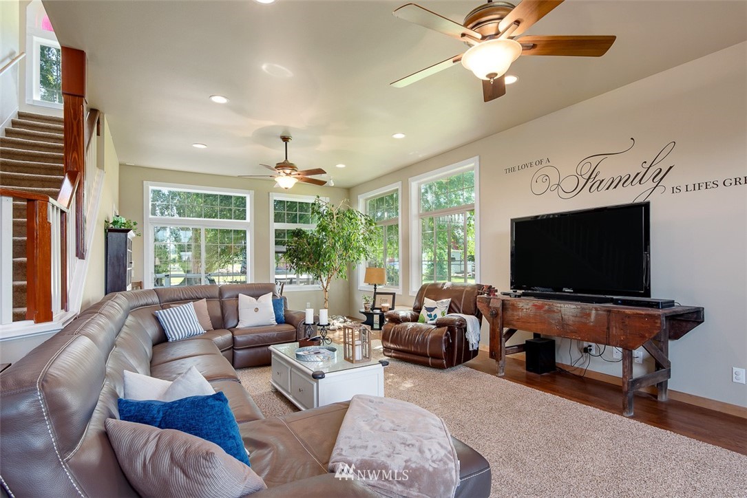 5495 Sand Road Bellingham, WA 98226 - Photo 14 of 40 a living room with furniture and a flat screen tv