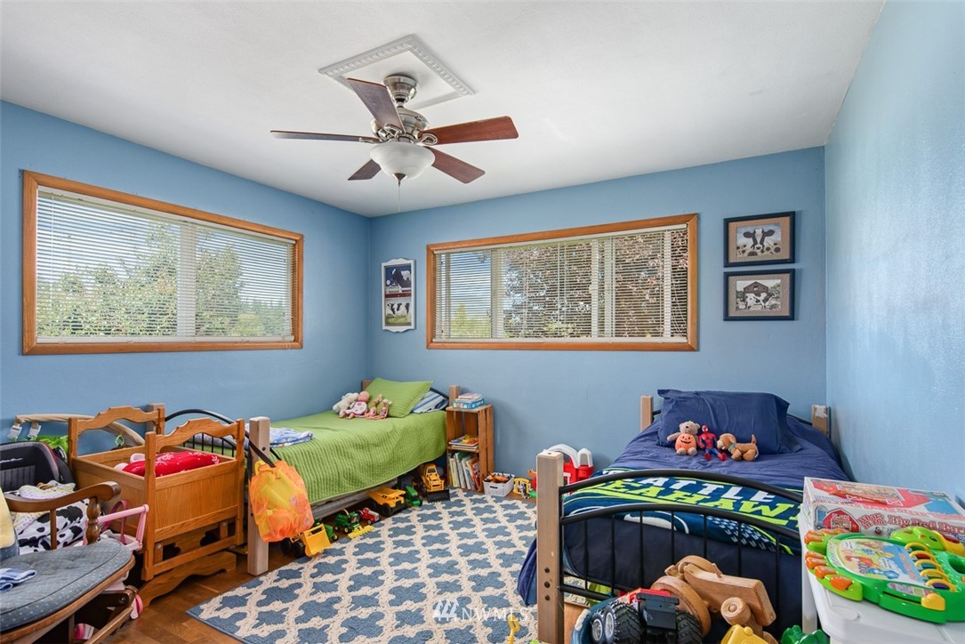 5495 Sand Road Bellingham, WA 98226 - Photo 22 of 40 a bedroom with bed and a window