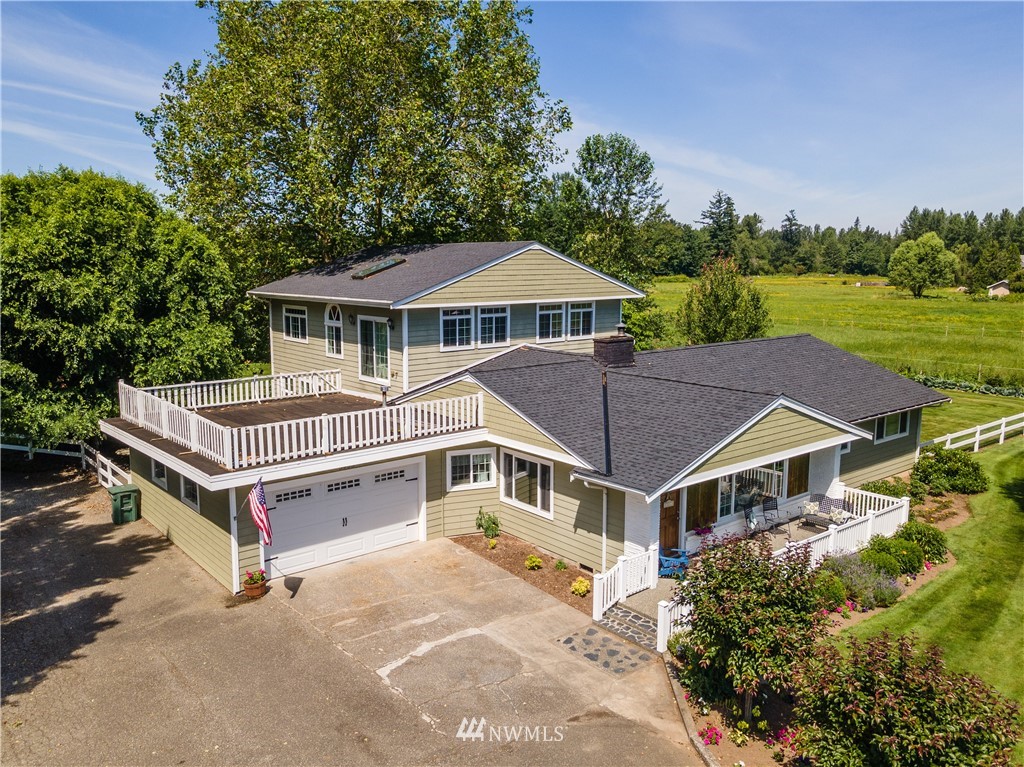 5495 Sand Road Bellingham, WA 98226 - Photo 4 of 40 a house with a trees in front of it