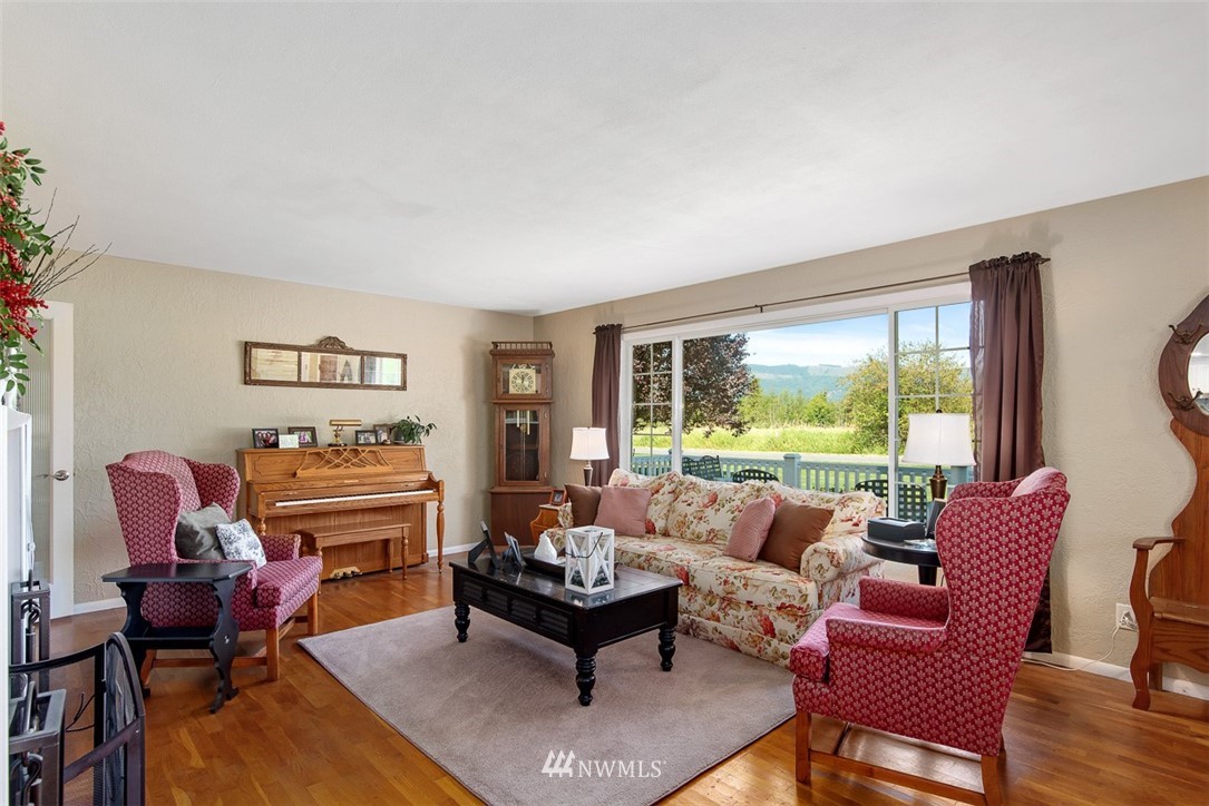 5495 Sand Road Bellingham, WA 98226 - Photo 6 of 40 a living room with furniture and a large window